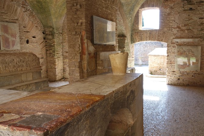 Ancient Ostia Antica Semi-Private Day Trip from Rome by Train with Guide - The Baths of Neptune and their famous mosaic
