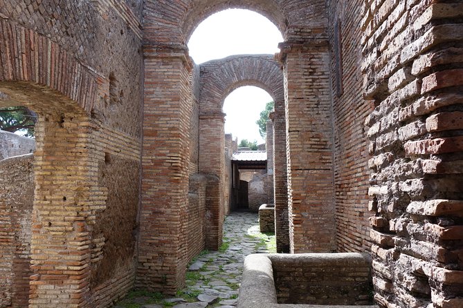 Ancient Ostia Antica Semi-Private Day Trip from Rome by Train with Guide - Taverns, apartments, and ordinary Roman life