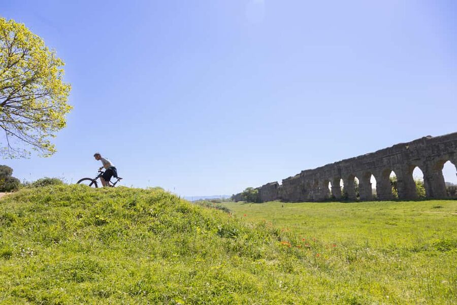 Rome:Appian Way E-bike Tour with Catacombs, Aqueducts & Food - Riding the ancient Appian Way