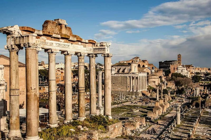 Rome: Colosseum & Forum Small Group Tour with Palatine Hill - Entering the Colosseum through the first and second tiers