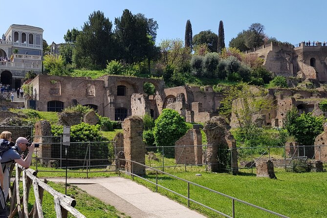 Rome: Colosseum, Palatine Hill and Roman Forum Guided Tour - Entering the Roman Forum along the Via Sacra