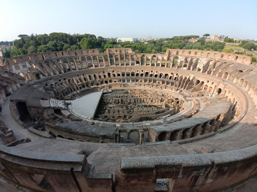 Rome: Colosseum, Palatine Hill, & Roman Forum Walking Tour - Entering the Colosseum on levels one and two