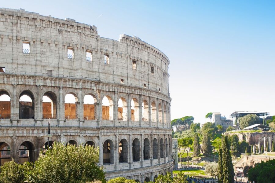 Rome: Colosseum, Roman Forum & Palatine Hill Tour - Walking the Roman Forum along the Via Sacra