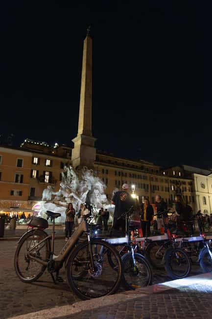 Rome: E-Bike Night Tour with Food and Wine Tasting - The salumeria stop for wine and Roman snacks