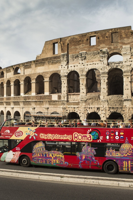 Rome: Hop-on Hop-off Bus Tour and Colosseum Experience - Riding the open-top bus around central Rome