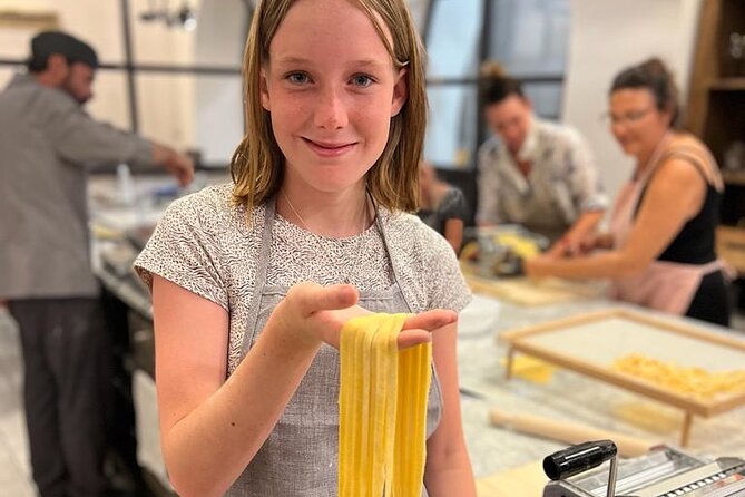 Super Fun Pasta & Gelato Class by Vatican with Wine + Oil Tasting - Making pasta by hand with a rolling pin